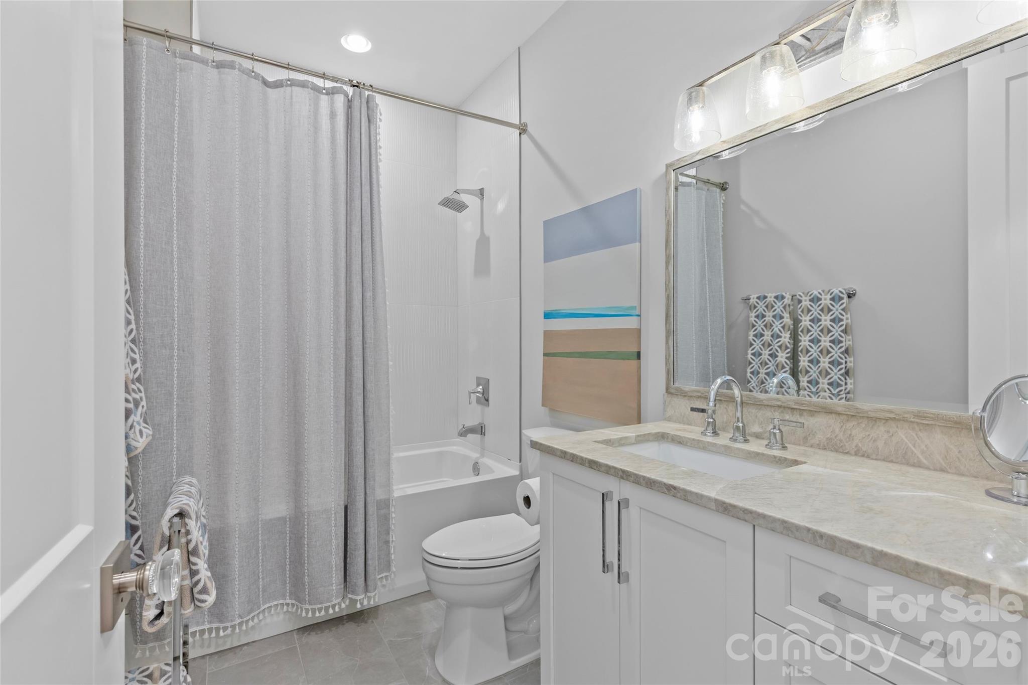 1500 Queens Road, Unit 104 Charlotte, NC 28207 - Photo 19 of 41 a bathroom with a granite countertop sink toilet and shower