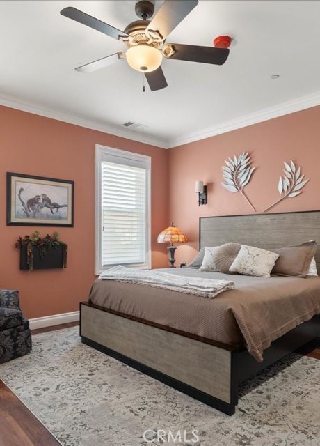 701 Rio Street Red Bluff, CA 96080 - Photo 50 of 73 a bedroom with a bed and a chandelier