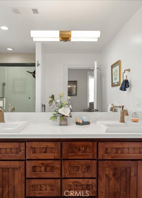 701 Rio Street Red Bluff, CA 96080 - Photo 65 of 73 a bathroom with a granite countertop sink and a mirror