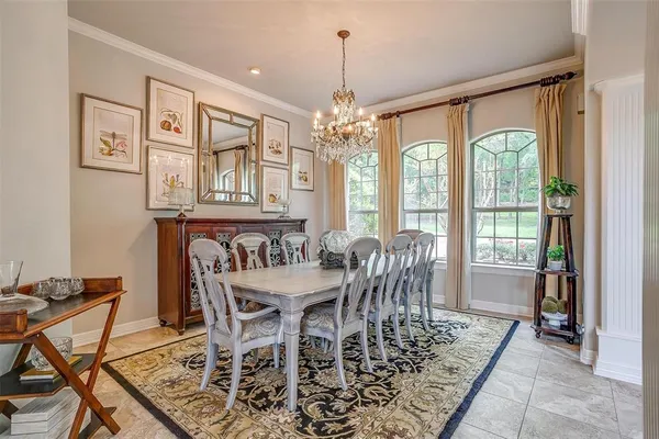 a dining hall with stainless steel appliances granite countertop a kitchen view and living room