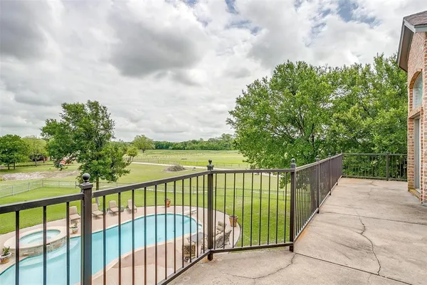 a view of a wrought iron fences in front of house
