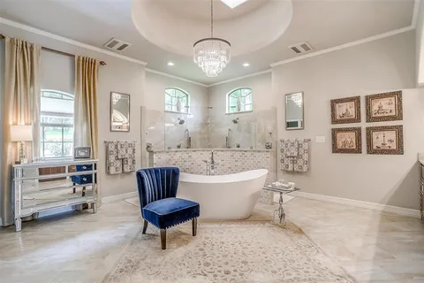 a spacious bathroom with a granite countertop sink and a mirror