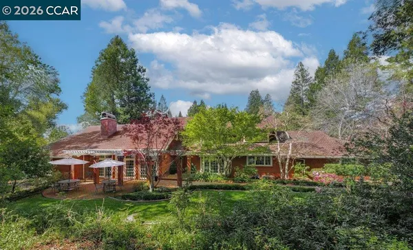 an aerial view of a house with yard table and chairs
