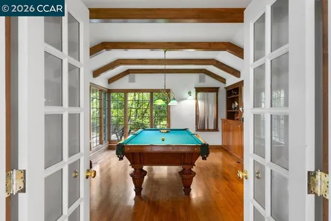 a dining room with a large window and table