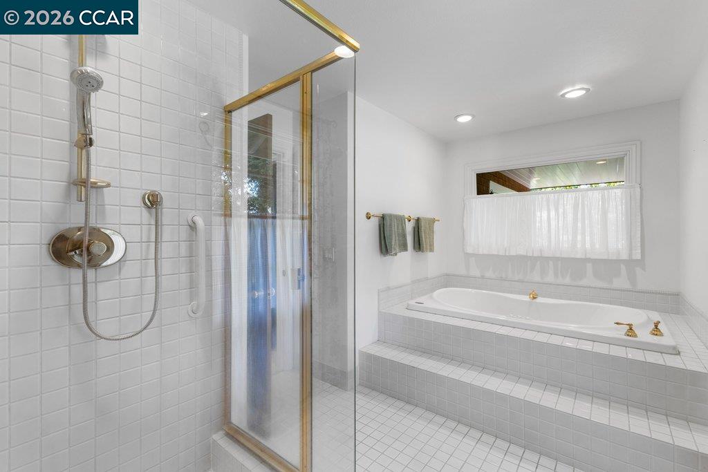 2255 Alameda Diablo Diablo, CA 94528 - Photo 25 of 49 a bathroom with a tub and shower