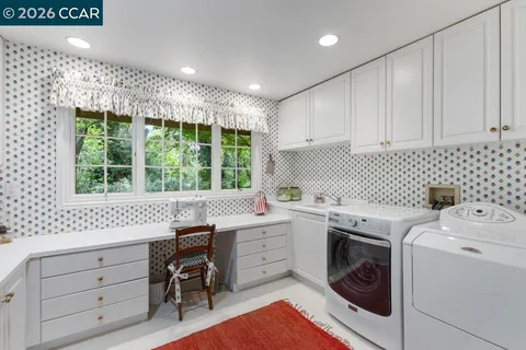 a view of a storage & utility room with washer and dryer