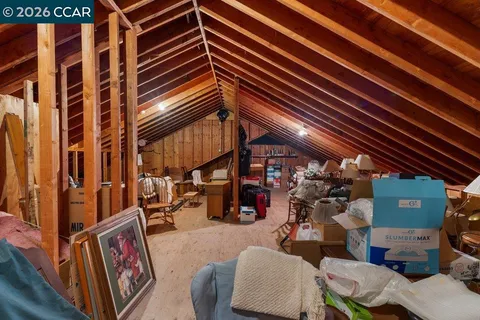 a front view of a house with a yard table and chairs