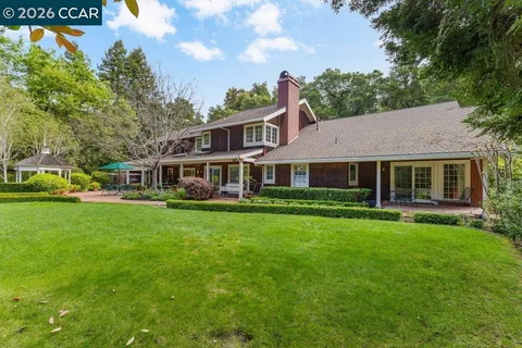 a view of a chair and table in the patio