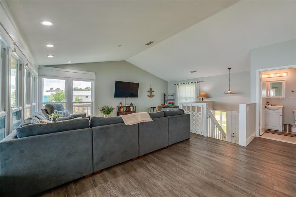 1633 Riverside Drive Daytona Beach, FL 32117 - Photo 11 of 25 a living room with furniture and a flat screen tv