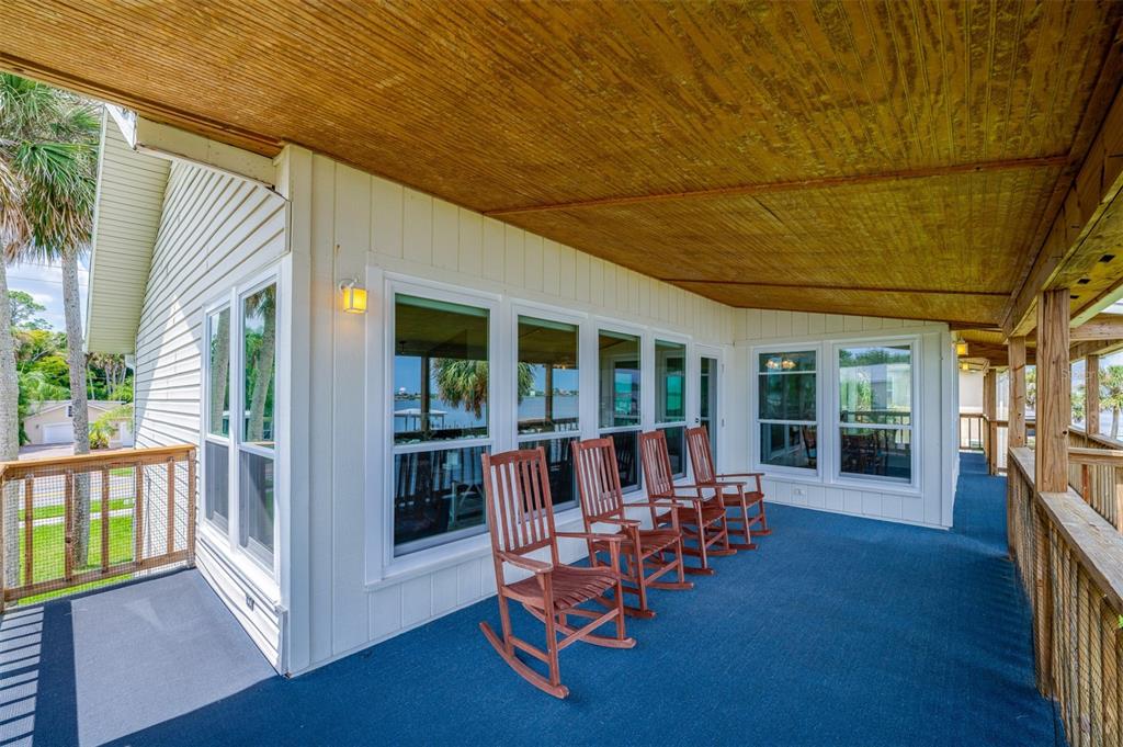 1633 Riverside Drive Daytona Beach, FL 32117 - Photo 12 of 25 a view of a house with backyard porch and sitting area