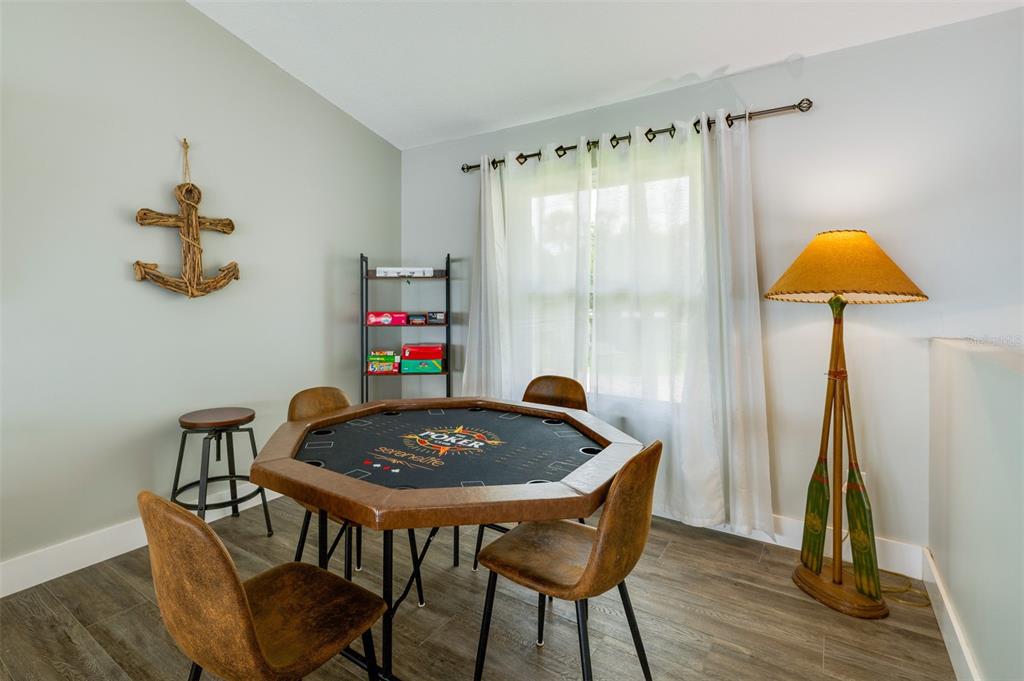 1633 Riverside Drive Daytona Beach, FL 32117 - Photo 14 of 25 a table and chairs in a small room