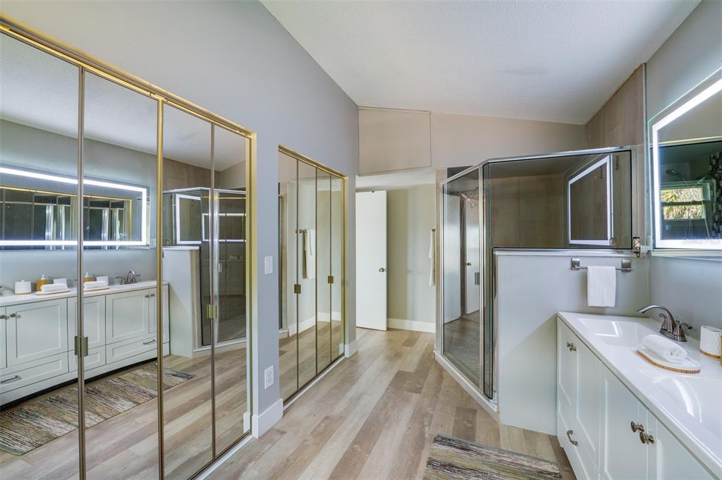 1633 Riverside Drive Daytona Beach, FL 32117 - Photo 17 of 25 a bathroom with a sink mirror and shower