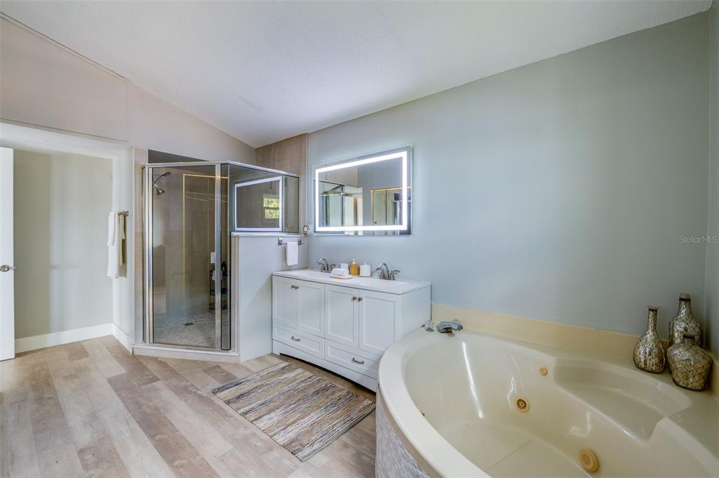 1633 Riverside Drive Daytona Beach, FL 32117 - Photo 18 of 25 a spacious bathroom with bathtub and shower