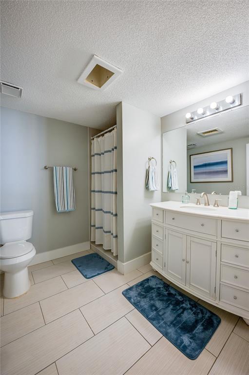 1633 Riverside Drive Daytona Beach, FL 32117 - Photo 22 of 25 a bathroom with a sink a toilet and mirror