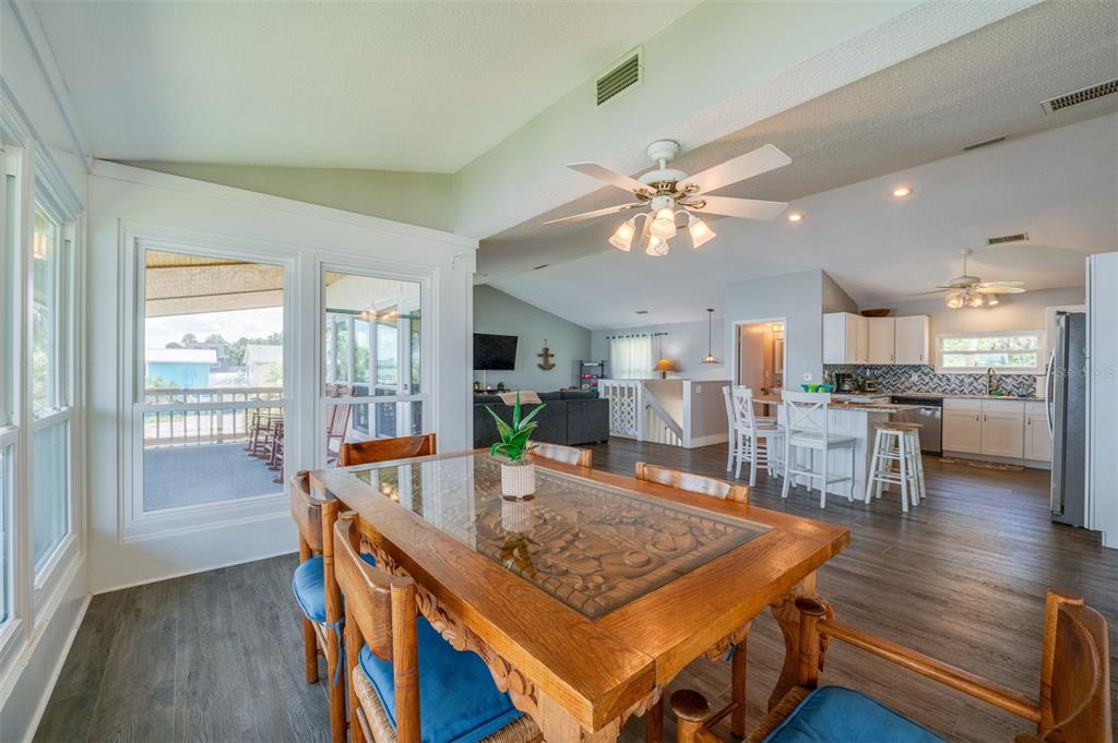 1633 Riverside Drive Daytona Beach, FL 32117 - Photo 8 of 25 a room with wooden floor pool table and chairs