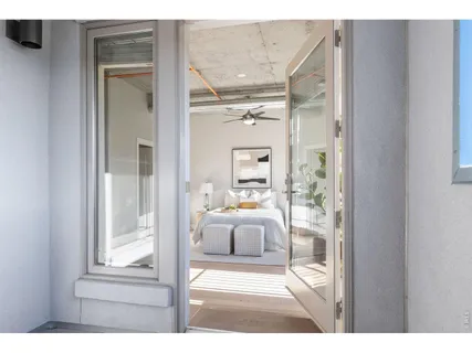 a picture of a bathroom with a tub and mirror