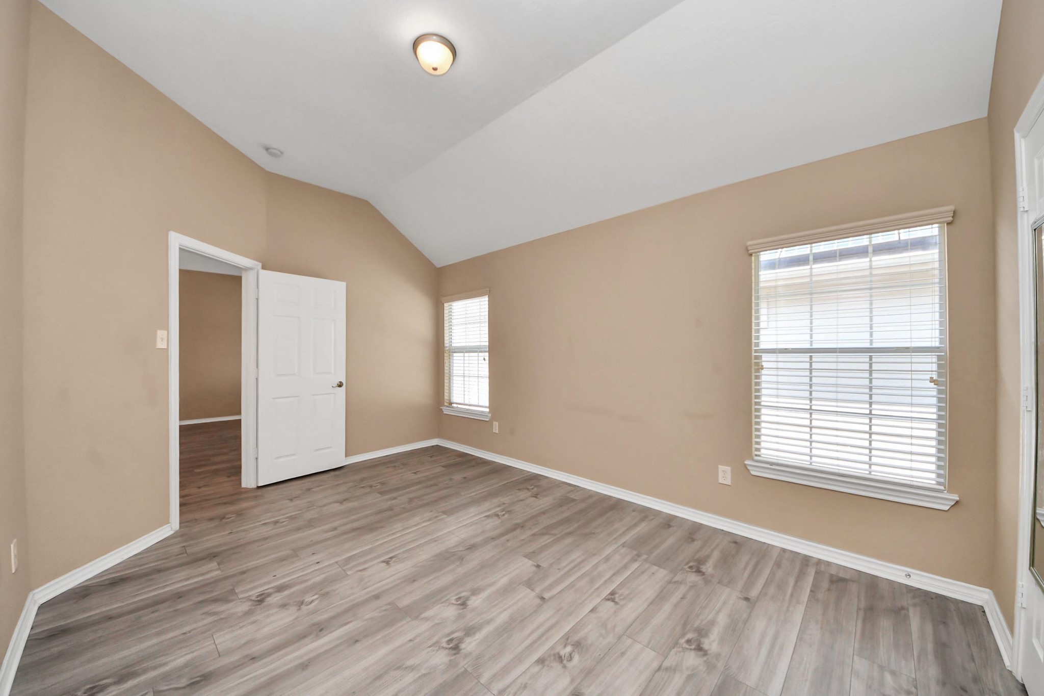 706 River Delta Lane Rosenberg, TX 77469 - Photo 34 of 50 an empty room with wooden floor and windows