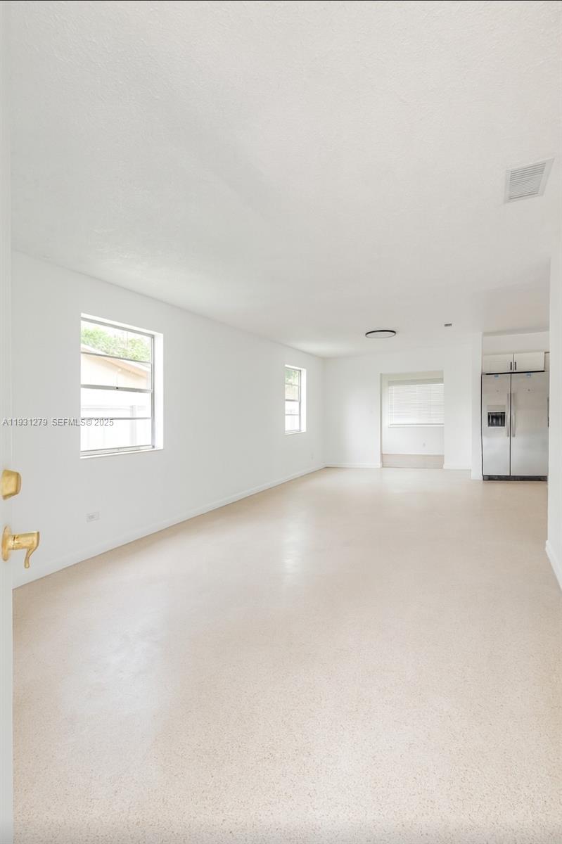 141 West 31st Street Hialeah, FL 33012 - Photo 2 of 9 a view of empty room with windows