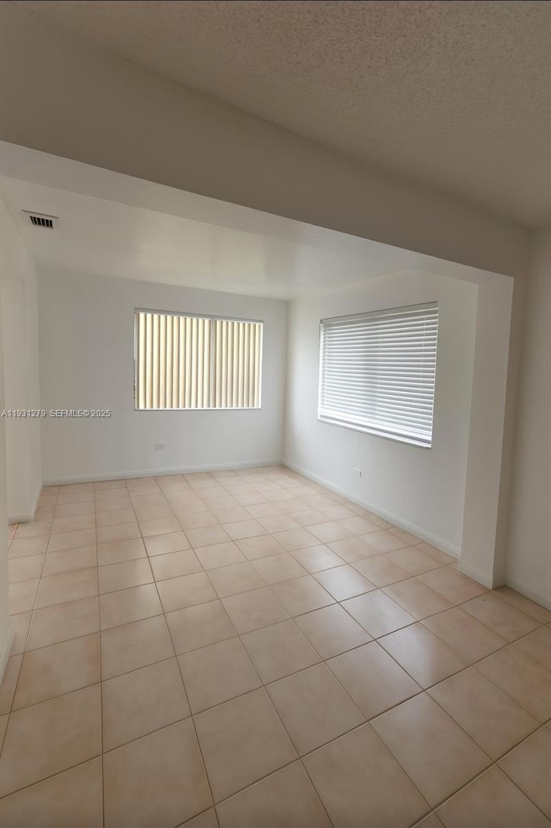 141 West 31st Street Hialeah, FL 33012 - Photo 8 of 9 a view of an empty room with a window