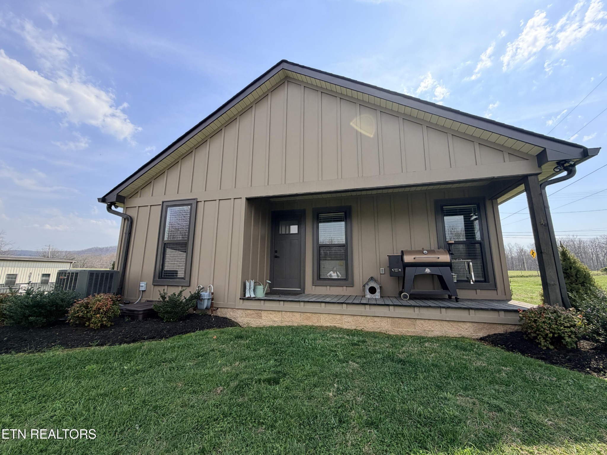 1021 Pleasant Grove Road Winfield, TN 37892 - Photo 17 of 42 a front view of a house with sitting area