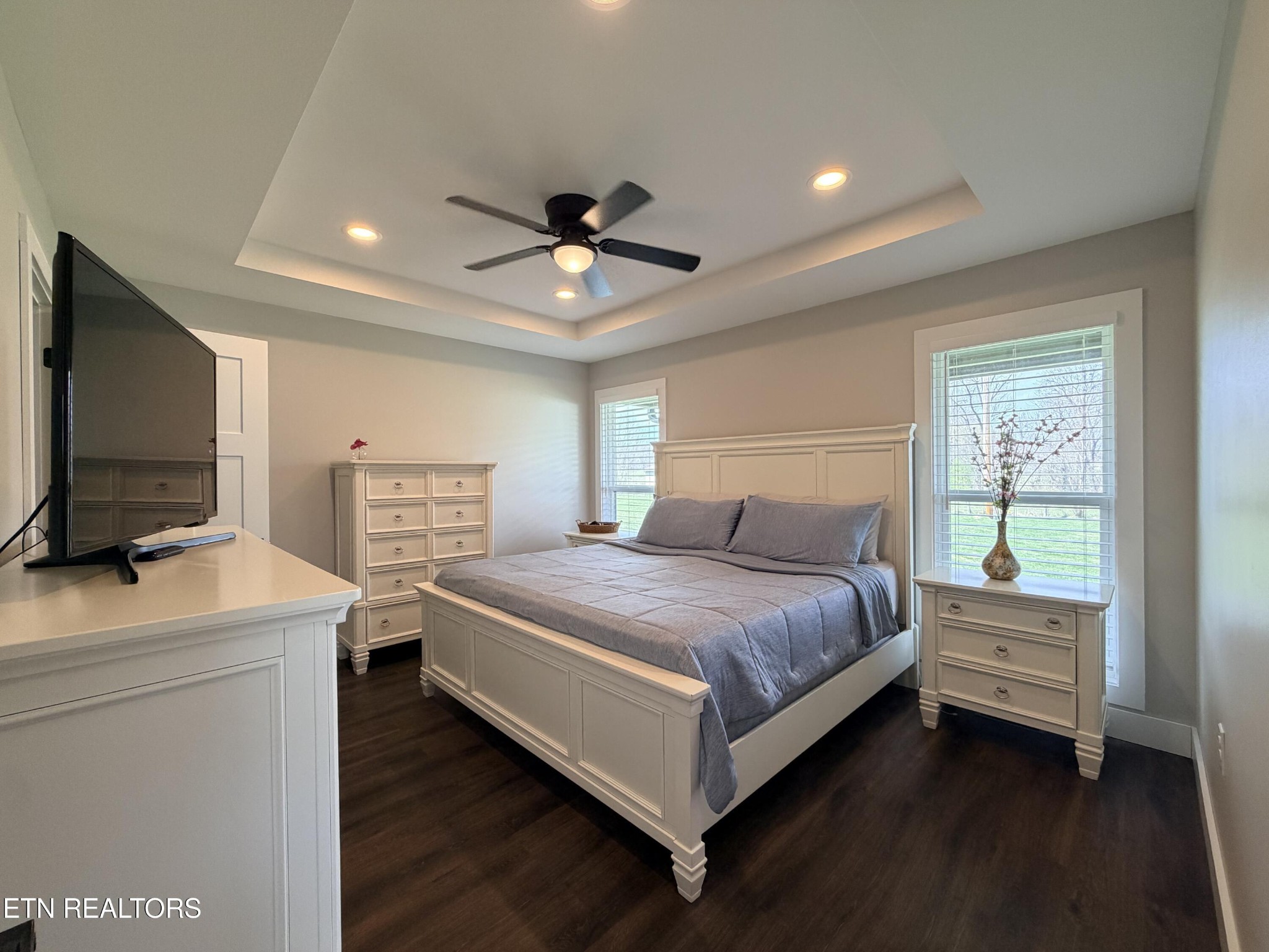 1021 Pleasant Grove Road Winfield, TN 37892 - Photo 30 of 42 a bedroom with a bed and a flat screen tv