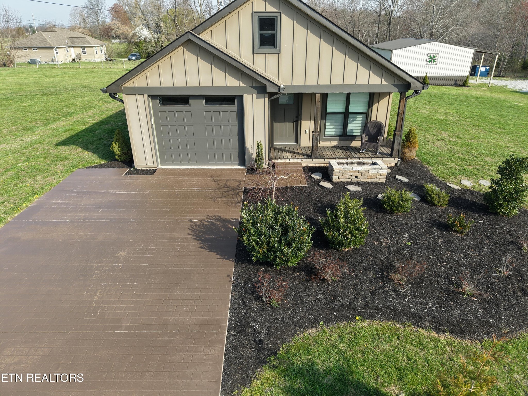 1021 Pleasant Grove Road Winfield, TN 37892 - Photo 3 of 42 a front view of a house with garden