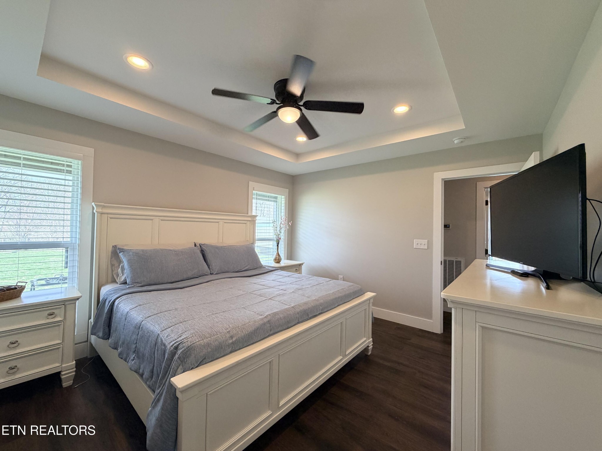 1021 Pleasant Grove Road Winfield, TN 37892 - Photo 31 of 42 a bedroom with a bed and a flat screen tv
