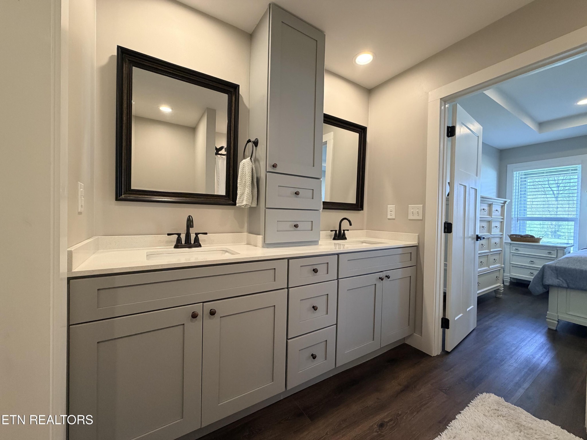 1021 Pleasant Grove Road Winfield, TN 37892 - Photo 32 of 42 a bathroom with double vanity sink a mirror and a shower