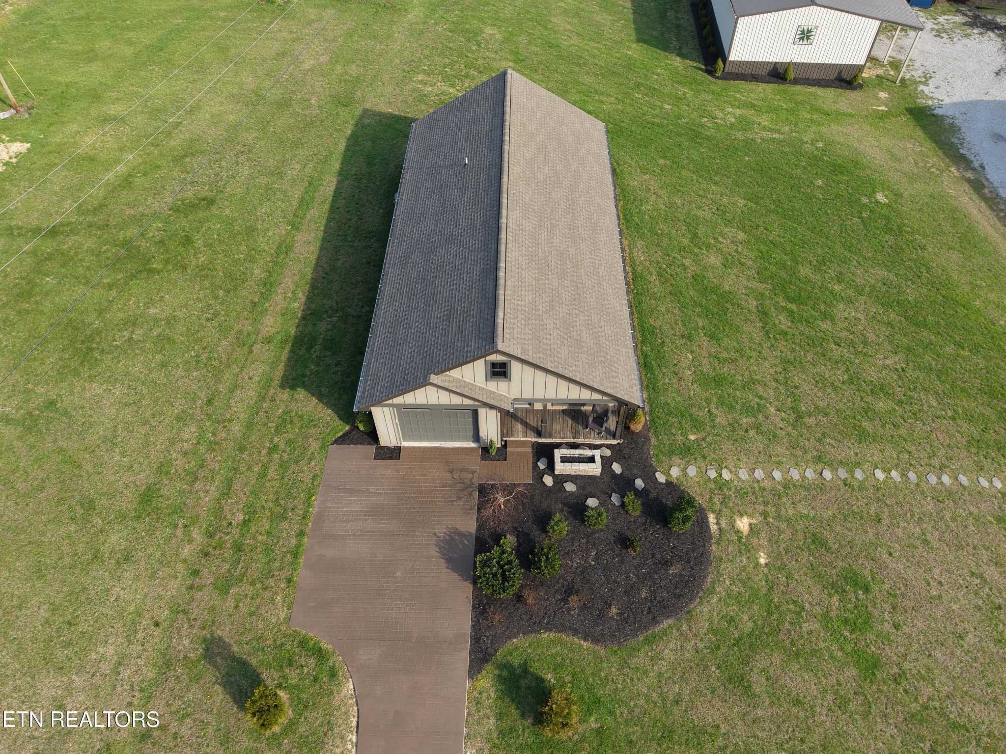 1021 Pleasant Grove Road Winfield, TN 37892 - Photo 8 of 42 a view of a tall building with a yard