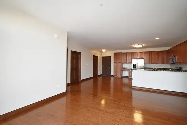 a view of kitchen with a refrigerator
