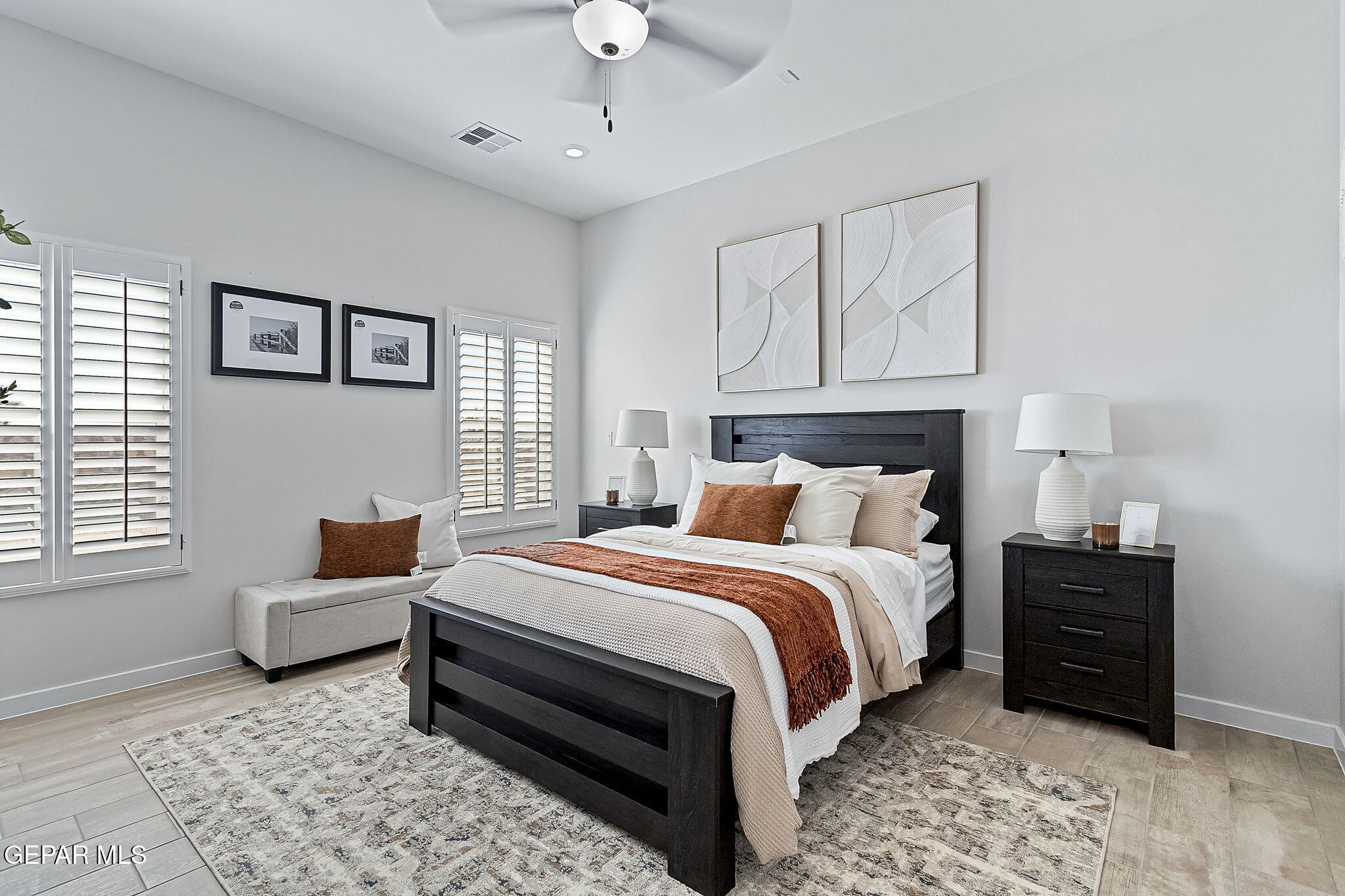 3861 Object Place El Paso, TX 79938 - Photo 2 of 17 a spacious bedroom with a bed a couch and a window