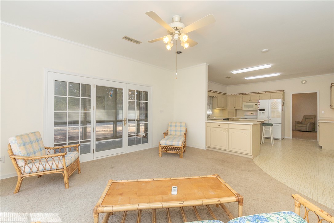 52 Hickory Way Clemson, SC 29631 - Photo 13 of 49 This bright living area features ample natural light and a seamless flow into the adjacent kitchen.