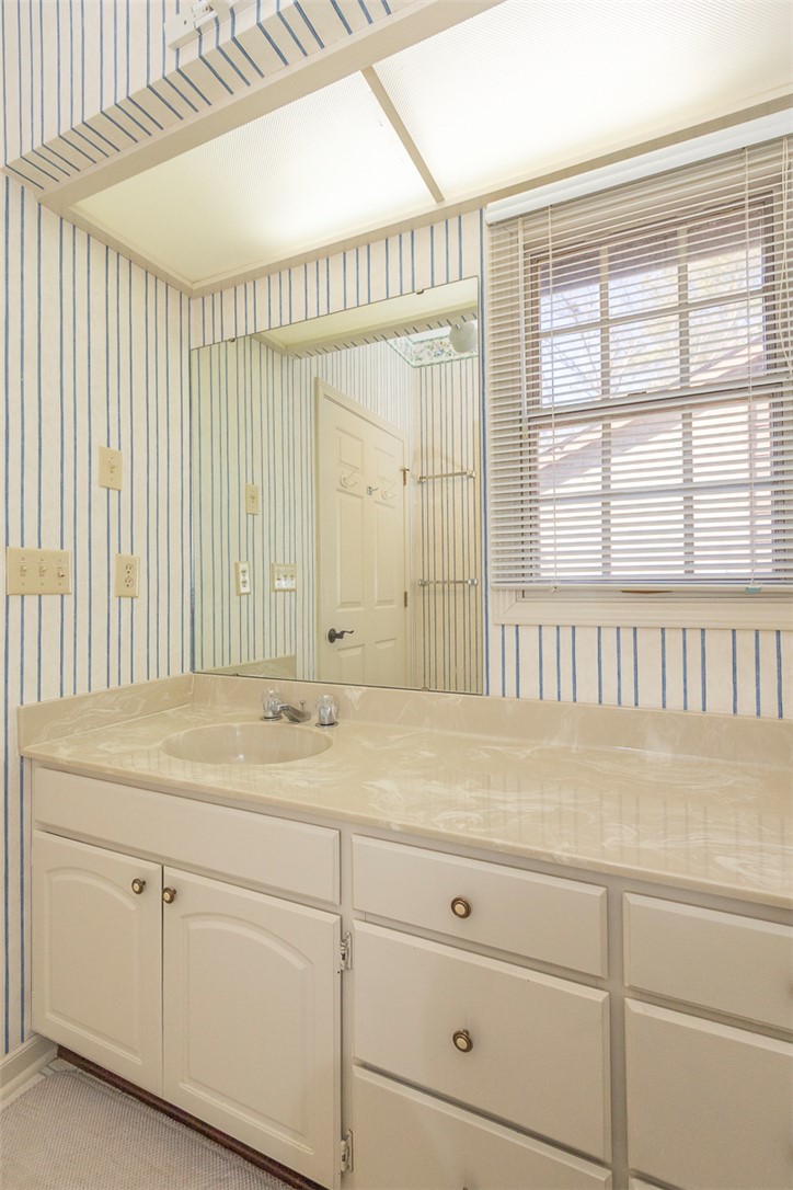 52 Hickory Way Clemson, SC 29631 - Photo 25 of 49 This bathroom features a functional vanity with ample storage and a clear mirror.
