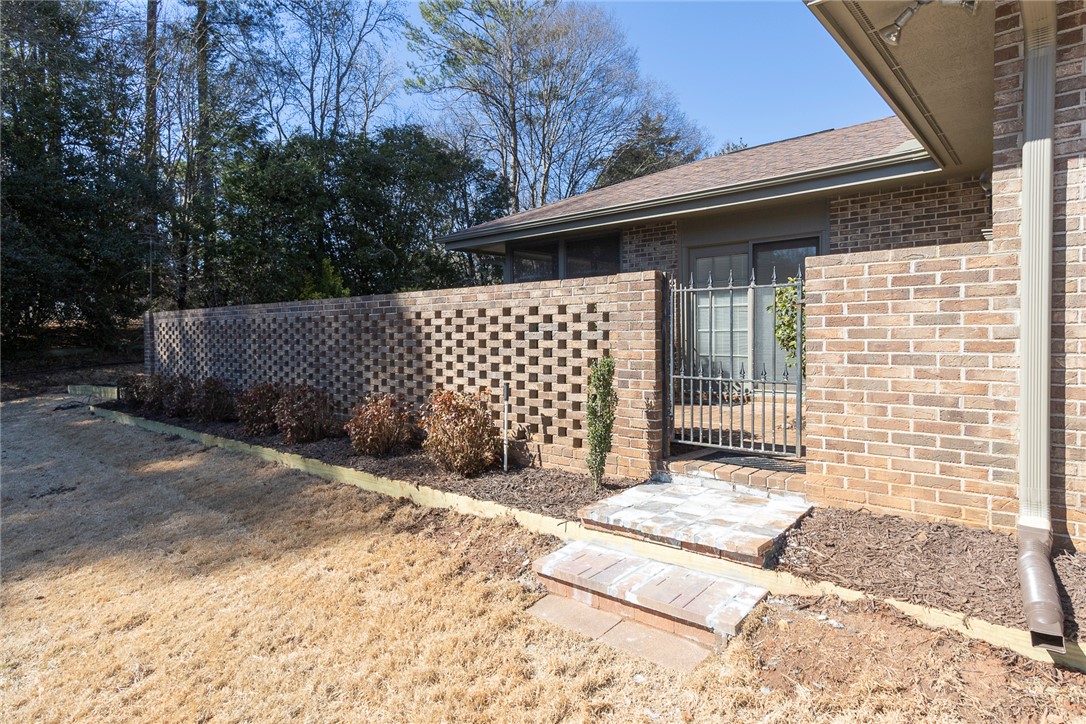 52 Hickory Way Clemson, SC 29631 - Photo 31 of 49 This charming home offers a private entrance with a decorative brick privacy wall.