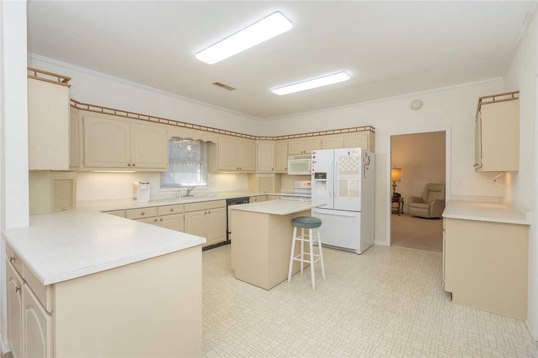 52 Hickory Way Clemson, SC 29631 - Photo 9 of 49 This spacious kitchen offers ample counter space and a convenient center island, perfect for culinary endeavors.
