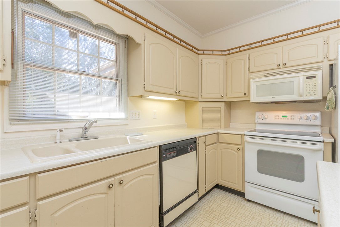 52 Hickory Way Clemson, SC 29631 - Photo 10 of 49 This bright kitchen features ample cabinetry and integrated appliances for modern living.