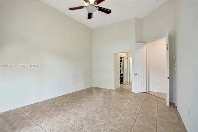 a kitchen with a sink a counter appliances and cabinets