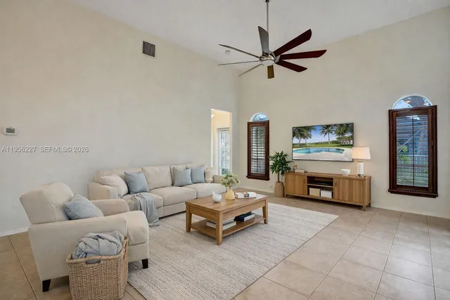 a view of a swimming pool and trees in the background