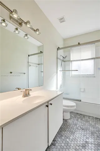 a street sign that is sitting on a sidewalk