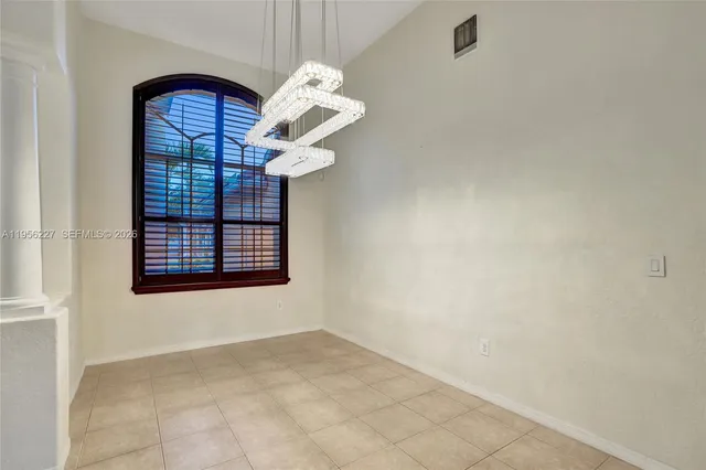 a view of an empty room and window