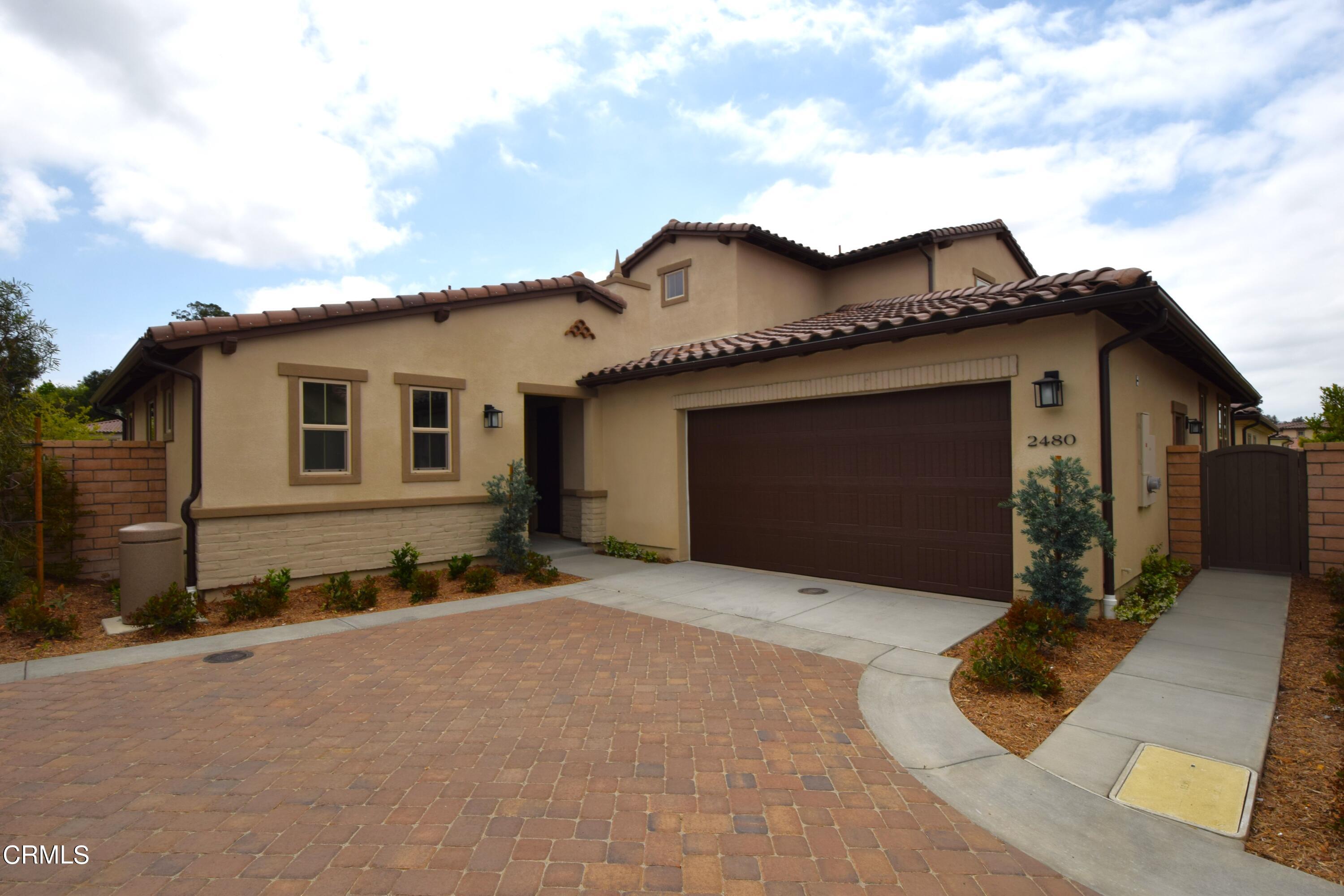 2480 Rondell Road Camarillo, CA 93012 - Photo 1 of 52 a front view of a house with a garage