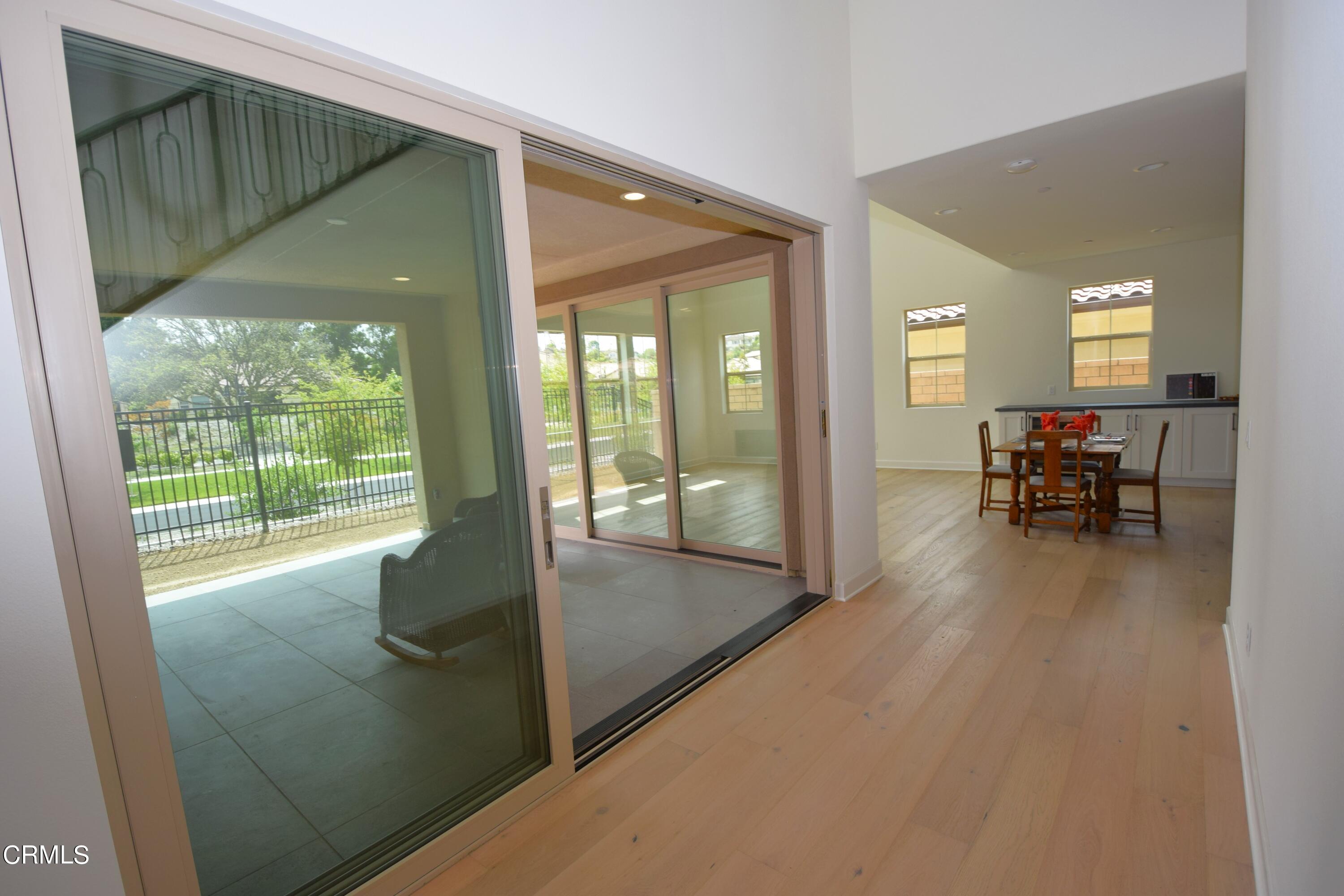 2480 Rondell Road Camarillo, CA 93012 - Photo 12 of 52 a view of a livingroom with furniture and floor to ceiling window