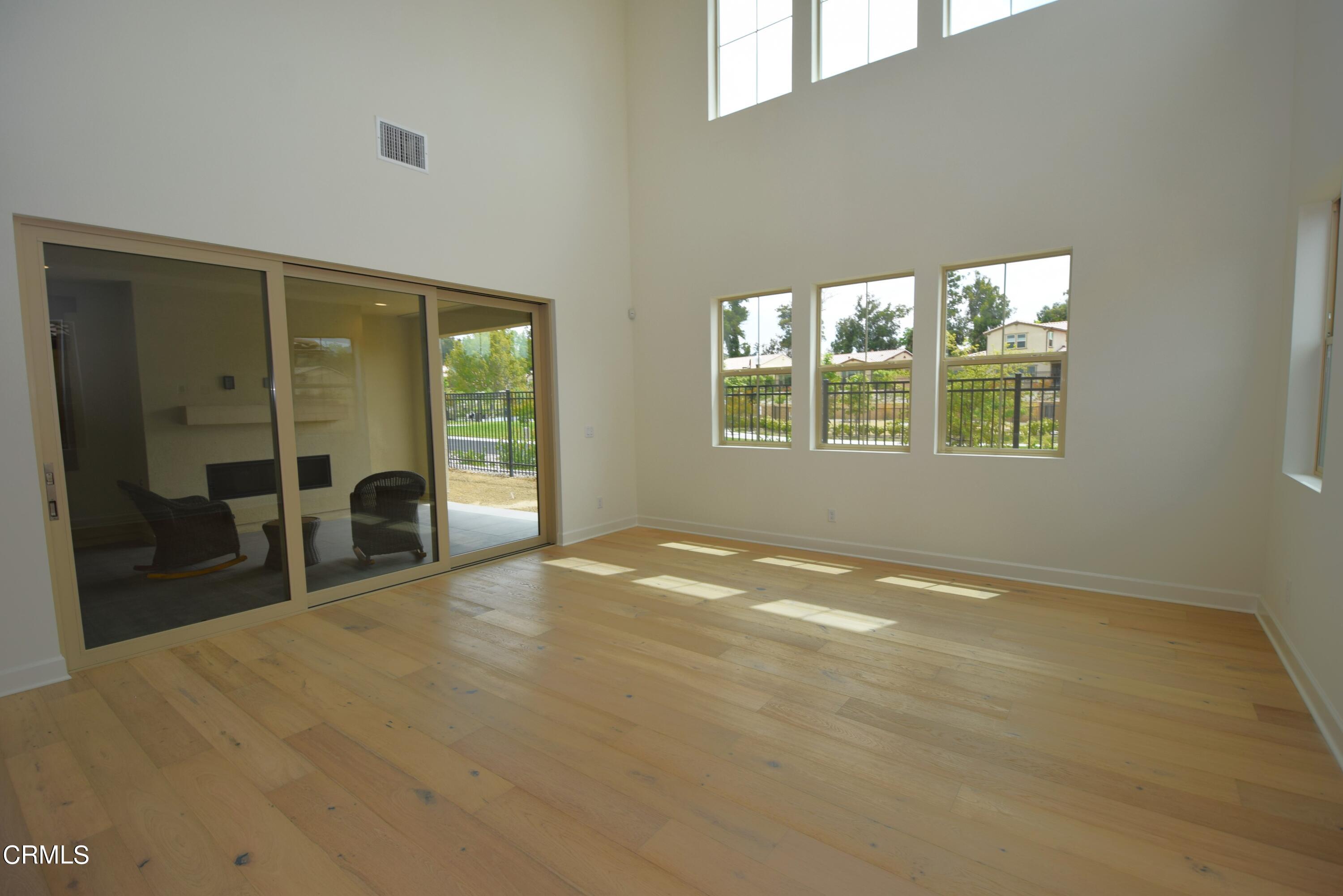 2480 Rondell Road Camarillo, CA 93012 - Photo 15 of 52 a view of an empty room with glass door and windows