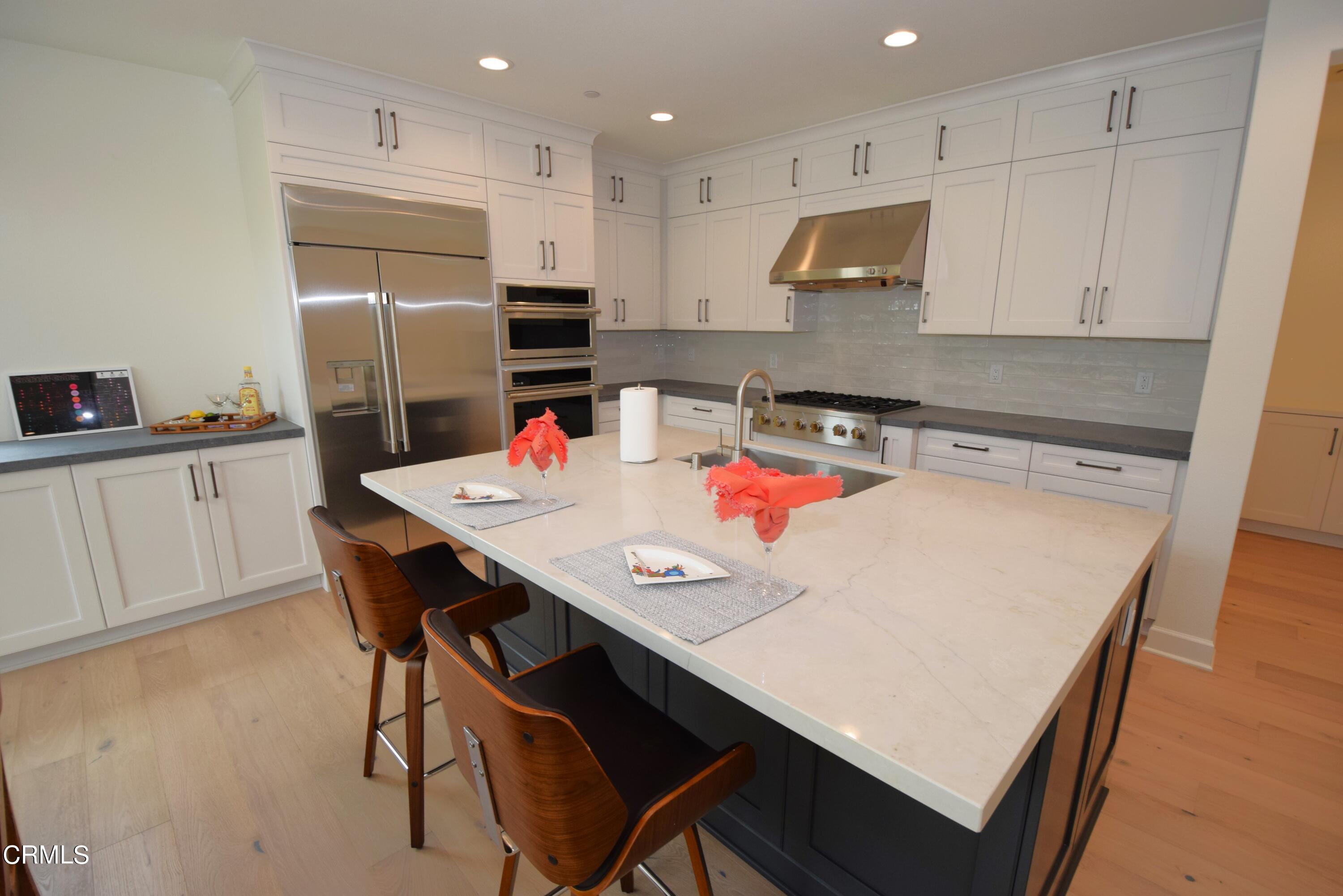 2480 Rondell Road Camarillo, CA 93012 - Photo 17 of 52 a kitchen that has a table and chairs in it