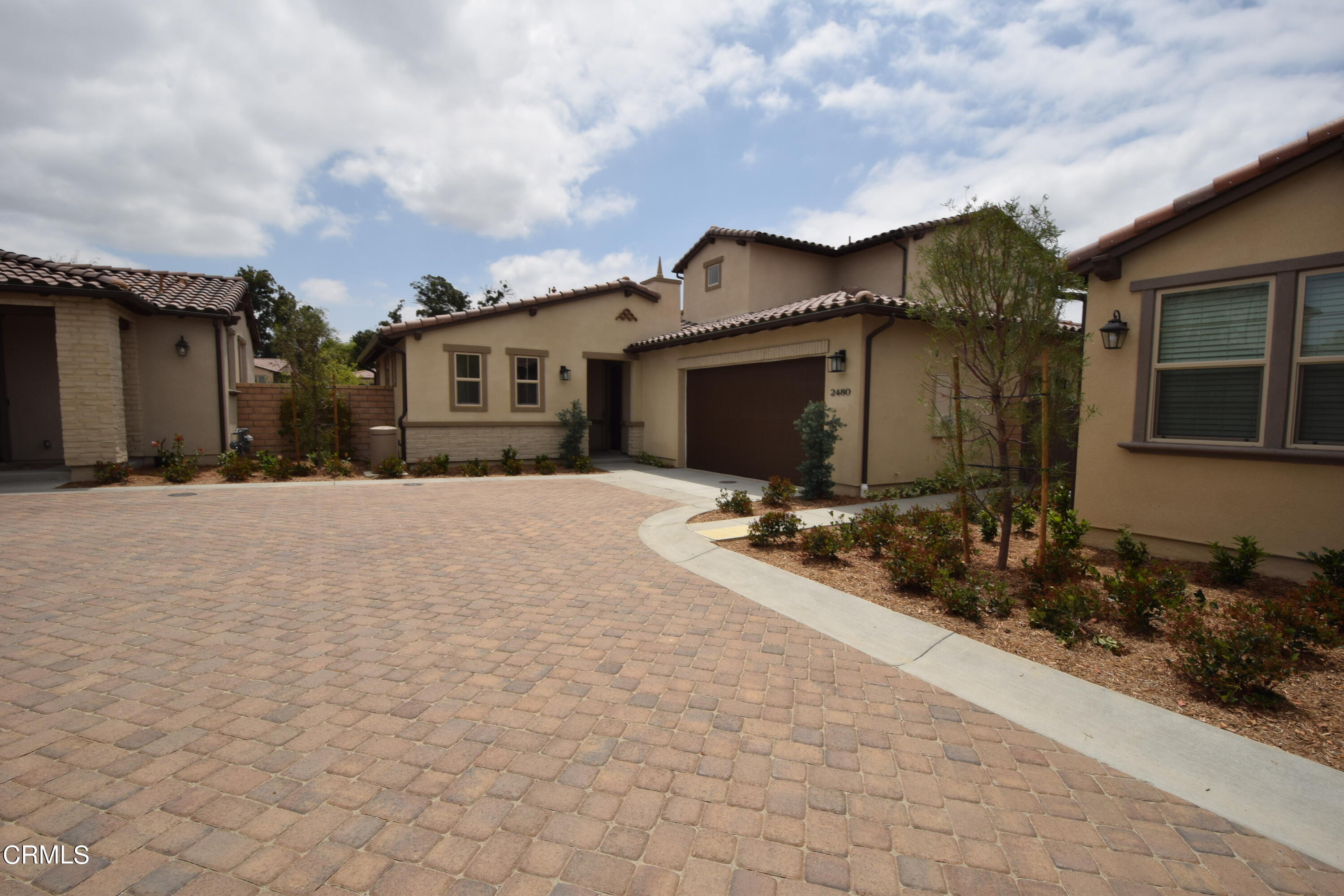 2480 Rondell Road Camarillo, CA 93012 - Photo 2 of 52 a front view of a house with a yard
