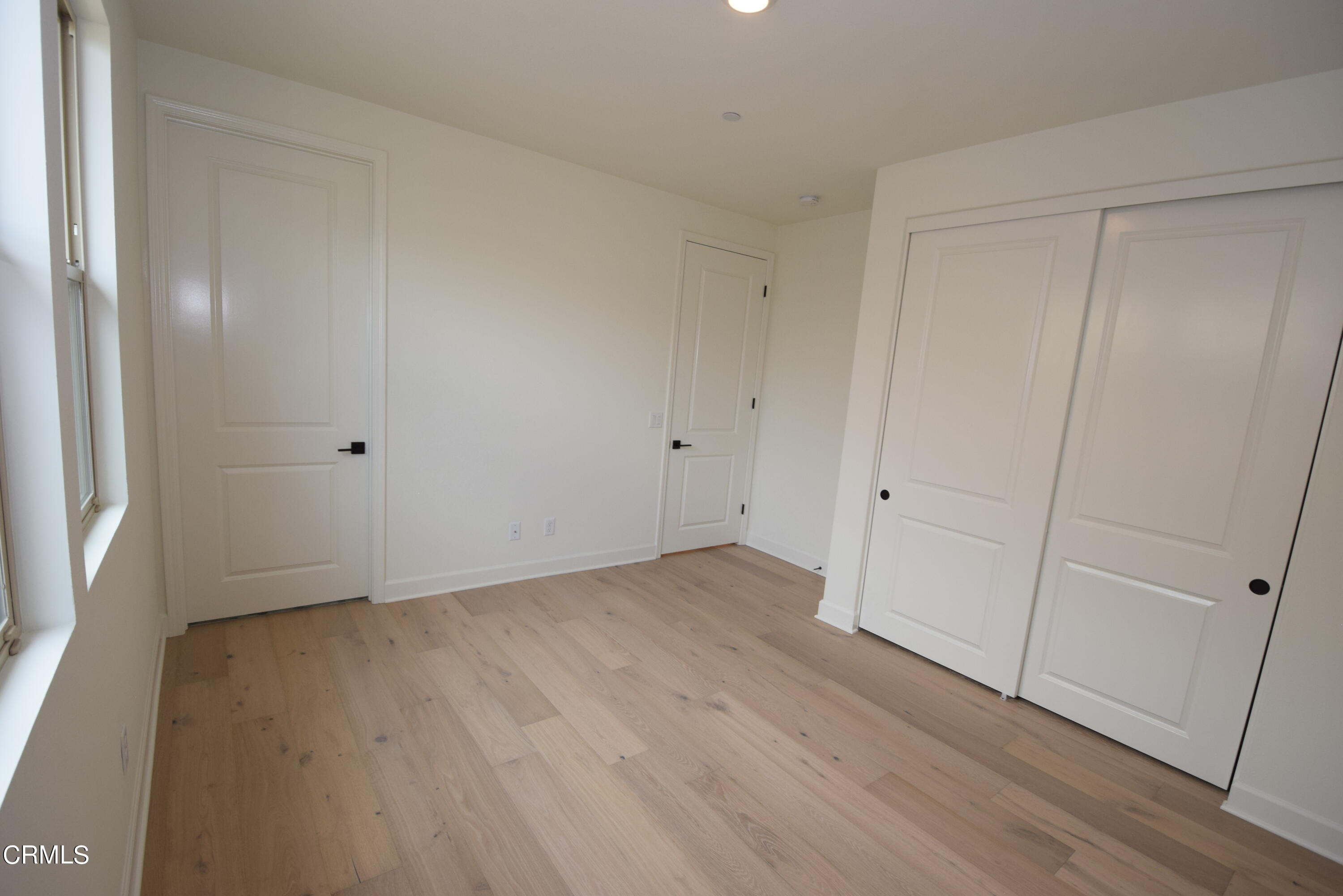 2480 Rondell Road Camarillo, CA 93012 - Photo 23 of 52 a view of an empty room with wooden floor