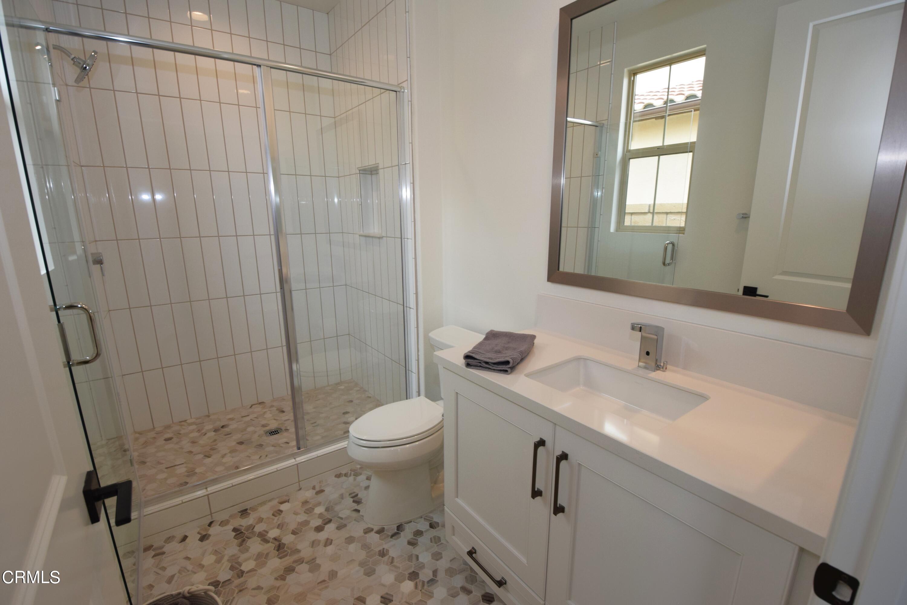2480 Rondell Road Camarillo, CA 93012 - Photo 24 of 52 a bathroom with a sink a toilet and shower