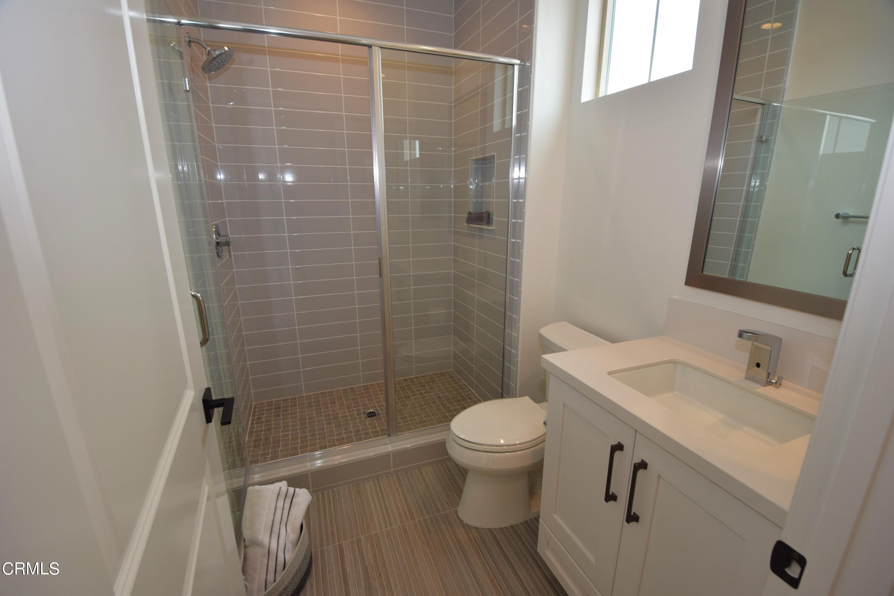 2480 Rondell Road Camarillo, CA 93012 - Photo 33 of 52 a bathroom with a sink toilet and shower
