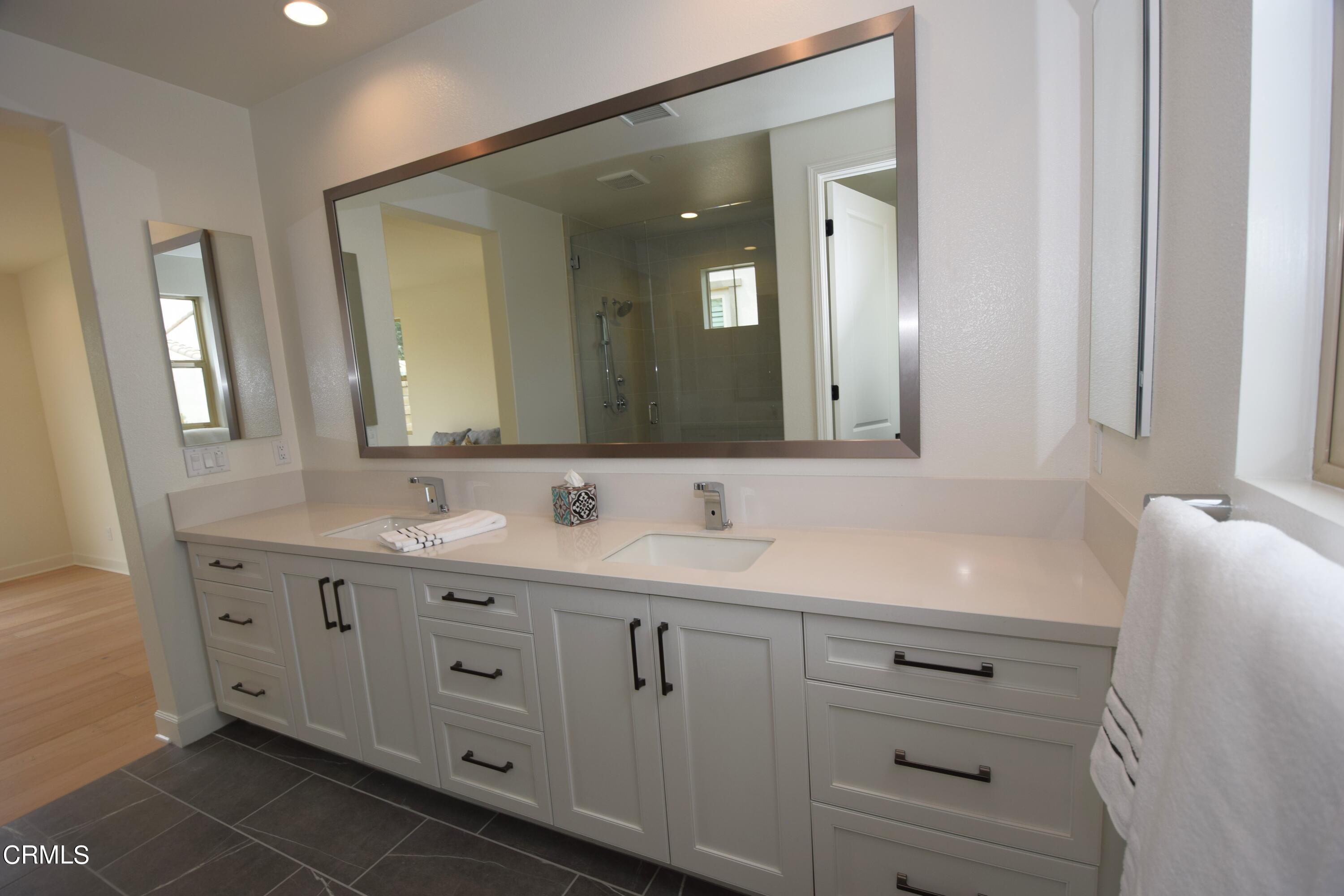 2480 Rondell Road Camarillo, CA 93012 - Photo 4 of 52 a bathroom with a double vanity sink mirror and