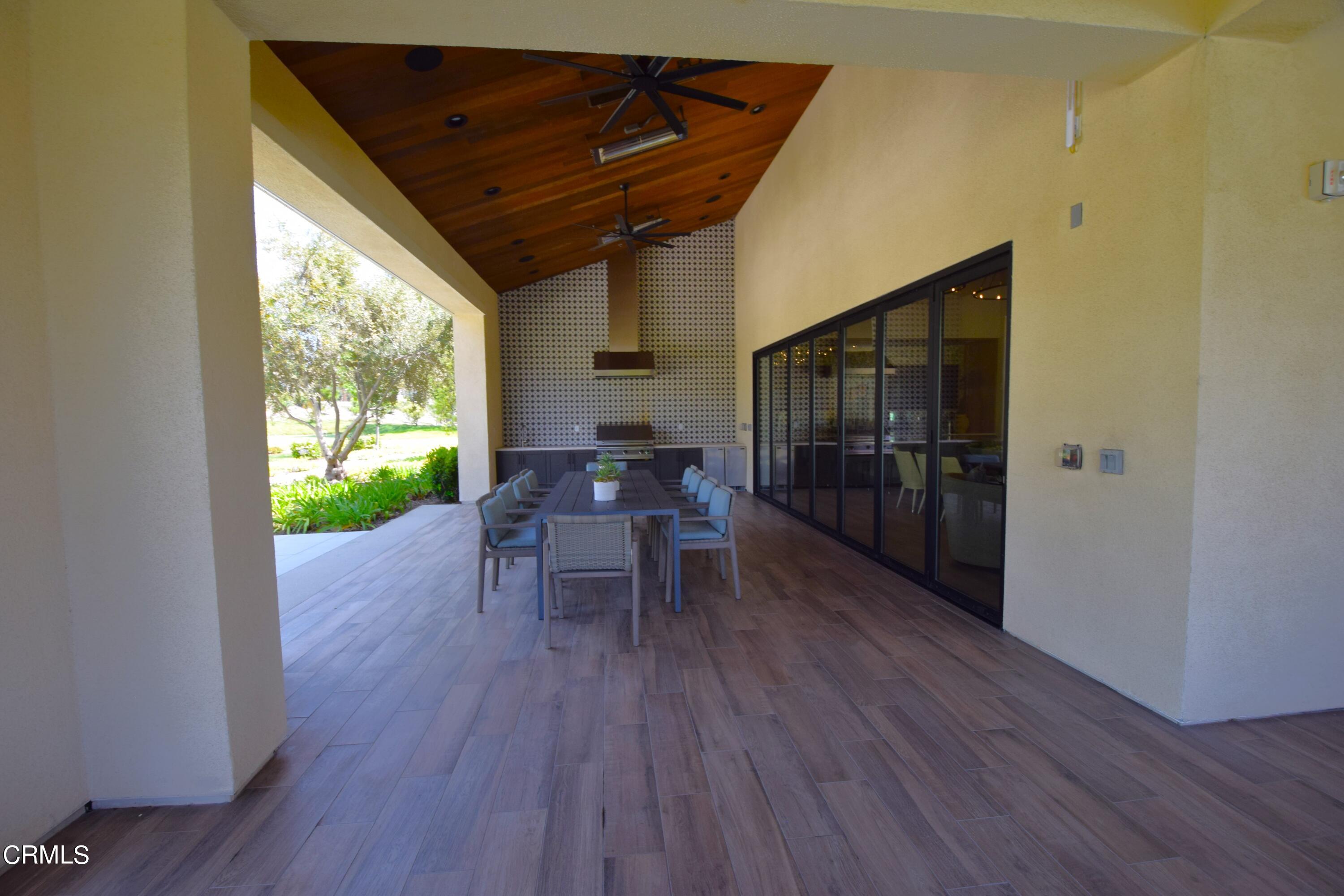 2480 Rondell Road Camarillo, CA 93012 - Photo 43 of 52 a dining room with furniture window and wooden floor